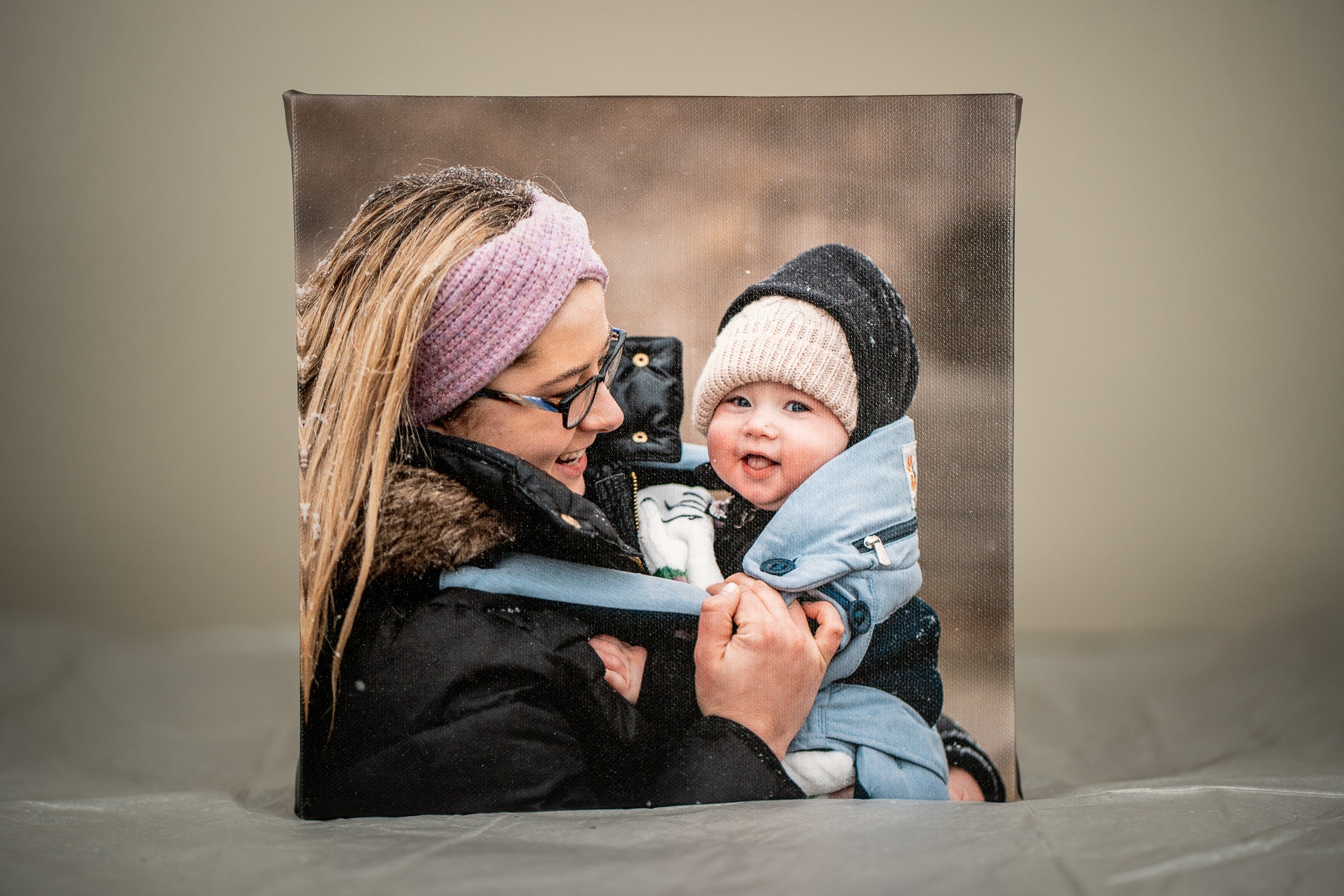 Custom canvas print of mother and baby smiling, showcasing high-quality Museum grade materials by Modern Canvas Company.